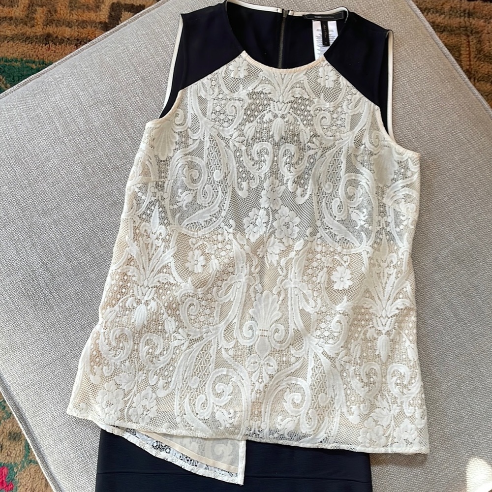 BCBG a sleeveless lasse cream and black blouse